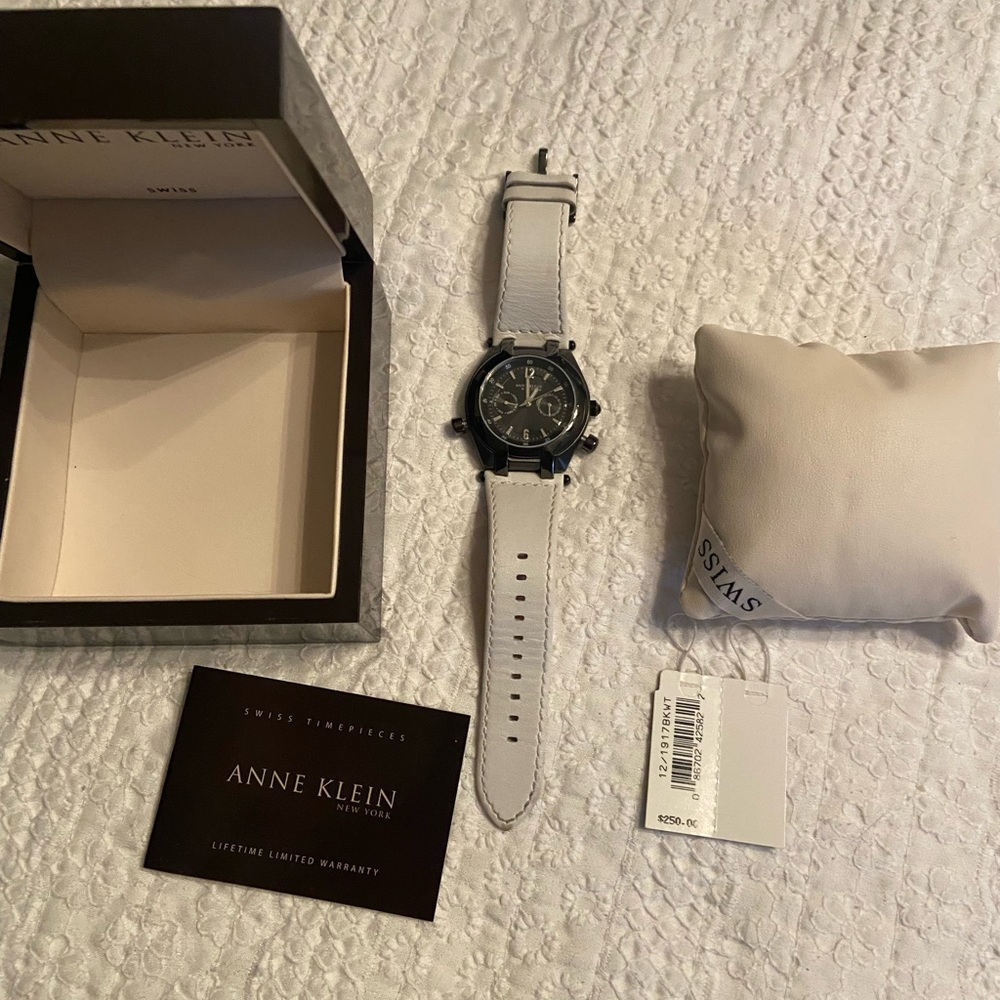 Anne Klein New York Swiss  Watch gunmetal face and white band. Needs battery